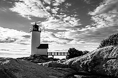 Low Sun Illuminates Rocky Shore By Annisquam Harbor Light -BW